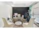 Bright office features a modern desk, comfortable seating, and an elliptical machine at 7838 Rollingridge Ct, Orlando, FL 32835