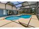 Sparkling screened-in pool with ample deck space for lounging and outdoor entertaining at 7838 Rollingridge Ct, Orlando, FL 32835