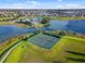 Aerial view of community amenities including tennis courts and a waterfront recreation area at 8057 John Hancock Dr, Winter Garden, FL 34787
