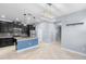 Modern kitchen featuring dark cabinets, stainless steel appliances, granite countertops and a center island at 8057 John Hancock Dr, Winter Garden, FL 34787