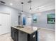 Bright kitchen with island, granite countertops, stainless steel appliances, and pendant lighting at 8057 John Hancock Dr, Winter Garden, FL 34787