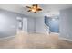 This bright and spacious living area features tile flooring and modern lighting fixtures at 8057 John Hancock Dr, Winter Garden, FL 34787