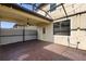 Covered patio with brick flooring and ceiling fan overlooking white fenced yard at 8057 John Hancock Dr, Winter Garden, FL 34787