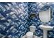 Powder room with unique blue leaf patterned wallpaper and pedestal sink at 8057 John Hancock Dr, Winter Garden, FL 34787