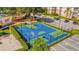 Aerial view of a well-maintained basketball court and parking area at 8100 Fan Palm Way, Kissimmee, FL 34747