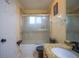 Bathroom with frosted glass shower, granite counters and tile flooring at 8100 Fan Palm Way, Kissimmee, FL 34747