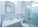 Bright bathroom with gray vanity, walk-in shower and modern fixtures at 8100 Fan Palm Way, Kissimmee, FL 34747