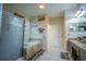Bright bathroom with a shower, garden tub with tile surround and dual vanity with granite counters at 8100 Fan Palm Way, Kissimmee, FL 34747