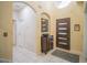 Bright foyer features tile flooring, high ceilings, decorative mirror and an elegant front door with sidelights at 8100 Fan Palm Way, Kissimmee, FL 34747