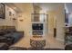 Comfortable living room with a large entertainment center and tiled floors at 8100 Fan Palm Way, Kissimmee, FL 34747