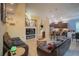 Spacious open-concept living area that connects the living room, dining area, and kitchen at 8100 Fan Palm Way, Kissimmee, FL 34747