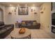 Cozy living room with leather furniture, decorative wall art, and neutral colors at 8100 Fan Palm Way, Kissimmee, FL 34747