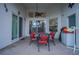 Covered patio perfect for outdoor dining with ceiling fan and view of the pool area at 8100 Fan Palm Way, Kissimmee, FL 34747