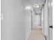 Neutral hallway showcases access to multiple rooms and plenty of natural light at 9014 Great Sound Dr, Orlando, FL 32827