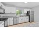 Bright kitchen boasts modern appliances, granite countertops, and ample storage at 9014 Great Sound Dr, Orlando, FL 32827