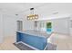 Bright kitchen features an island, updated appliances, and a large adjacent dining space at 9014 Great Sound Dr, Orlando, FL 32827