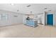 Bright kitchen features an island, updated appliances, and a large adjacent dining space at 9014 Great Sound Dr, Orlando, FL 32827