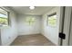 Bright bedroom with natural light streaming through multiple windows and light-toned hardwood floors at 1011 W 16Th St, Sanford, FL 32771