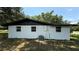 Exterior view of the house showing new windows and siding at 1011 W 16Th St, Sanford, FL 32771