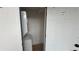 Functional laundry room with stacked washer and dryer and ample storage at 1011 W 16Th St, Sanford, FL 32771