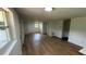 Spacious, light-filled living room featuring new hardwood floors and neutral paint at 1011 W 16Th St, Sanford, FL 32771