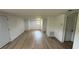 Bright living room with hardwood floors, white walls, and natural light through the window at 1011 W 16Th St, Sanford, FL 32771