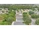 Birds-eye view showcasing a community with tree-lined streets and manicured lawns at 10984 Pinewood Cove Ln, Orlando, FL 32817