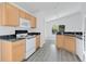 Well-lit kitchen with ample cabinet space, modern appliances, and durable countertops at 10984 Pinewood Cove Ln, Orlando, FL 32817