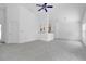 Spacious living room featuring plush carpeting, high ceilings, and lots of natural light at 10984 Pinewood Cove Ln, Orlando, FL 32817