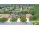 A charming single-Gathering home with mature trees, a driveway, and a well-manicured lawn, surrounded by similar homes at 1107 Carringdale Dr, Orlando, FL 32828