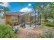 Charming backyard with enclosed patio and well-manicured landscaping at 1107 Carringdale Dr, Orlando, FL 32828