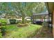 Well-maintained backyard with enclosed patio and mature landscaping at 1107 Carringdale Dr, Orlando, FL 32828
