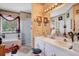 Bright bathroom features double sinks, soaking tub and walk in shower at 1107 Carringdale Dr, Orlando, FL 32828