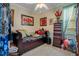 Cozy bedroom with unique wall art and comfortable furnishings at 1107 Carringdale Dr, Orlando, FL 32828