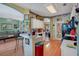 Bright kitchen featuring white cabinets, wood floors and an open layout at 1107 Carringdale Dr, Orlando, FL 32828