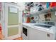 Functional laundry room with modern washer, dryer and plenty of storage at 1107 Carringdale Dr, Orlando, FL 32828
