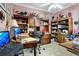 Inviting home office with ample desk space, wooden built-ins and natural light at 1107 Carringdale Dr, Orlando, FL 32828