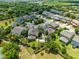 Aerial view of home showcasing manicured landscaping, large backyard complete with custom water feature, pool and outdoor kitchen at 12530 Climbing Vine Ct, Windermere, FL 34786