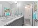 Stylish bathroom features an eye-catching sink and a well-lit mirror at 12530 Climbing Vine Ct, Windermere, FL 34786