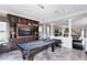 Spacious game room features a pool table, custom built-ins, and an open layout perfect for entertaining at 12530 Climbing Vine Ct, Windermere, FL 34786