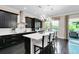 Elegant kitchen features modern appliances, a central island, and direct access to the outdoor area at 12530 Climbing Vine Ct, Windermere, FL 34786