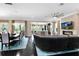 Spacious living room and dining area featuring hardwood floors, a fireplace, and seamless open-concept design at 12530 Climbing Vine Ct, Windermere, FL 34786
