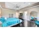 Bright main bedroom with detailed ceilings, dark wood floors, and natural light at 12530 Climbing Vine Ct, Windermere, FL 34786