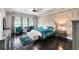 Luxurious main bedroom suite with tray ceiling, accent wall, and sitting area at 12530 Climbing Vine Ct, Windermere, FL 34786