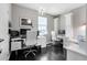 Well-lit home office with matching desks, cabinets, and hardwood floors at 12530 Climbing Vine Ct, Windermere, FL 34786