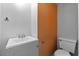 Compact bathroom featuring a clean sink, toilet, and simple design, ideal for functionality and convenience at 1330 Lakeview Rd, Lake Wales, FL 33853