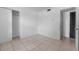 A light and airy bedroom features a closet and neutral tile floors at 1330 Lakeview Rd, Lake Wales, FL 33853