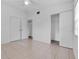 Bedroom featuring neutral tile floors, ceiling fan, and dual closets at 1330 Lakeview Rd, Lake Wales, FL 33853