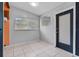 Entryway with neutral walls, tile flooring, and modern lighting, perfect for welcoming guests at 1330 Lakeview Rd, Lake Wales, FL 33853