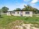 Exterior view of home with large lawn and AC Unit at 1330 Lakeview Rd, Lake Wales, FL 33853